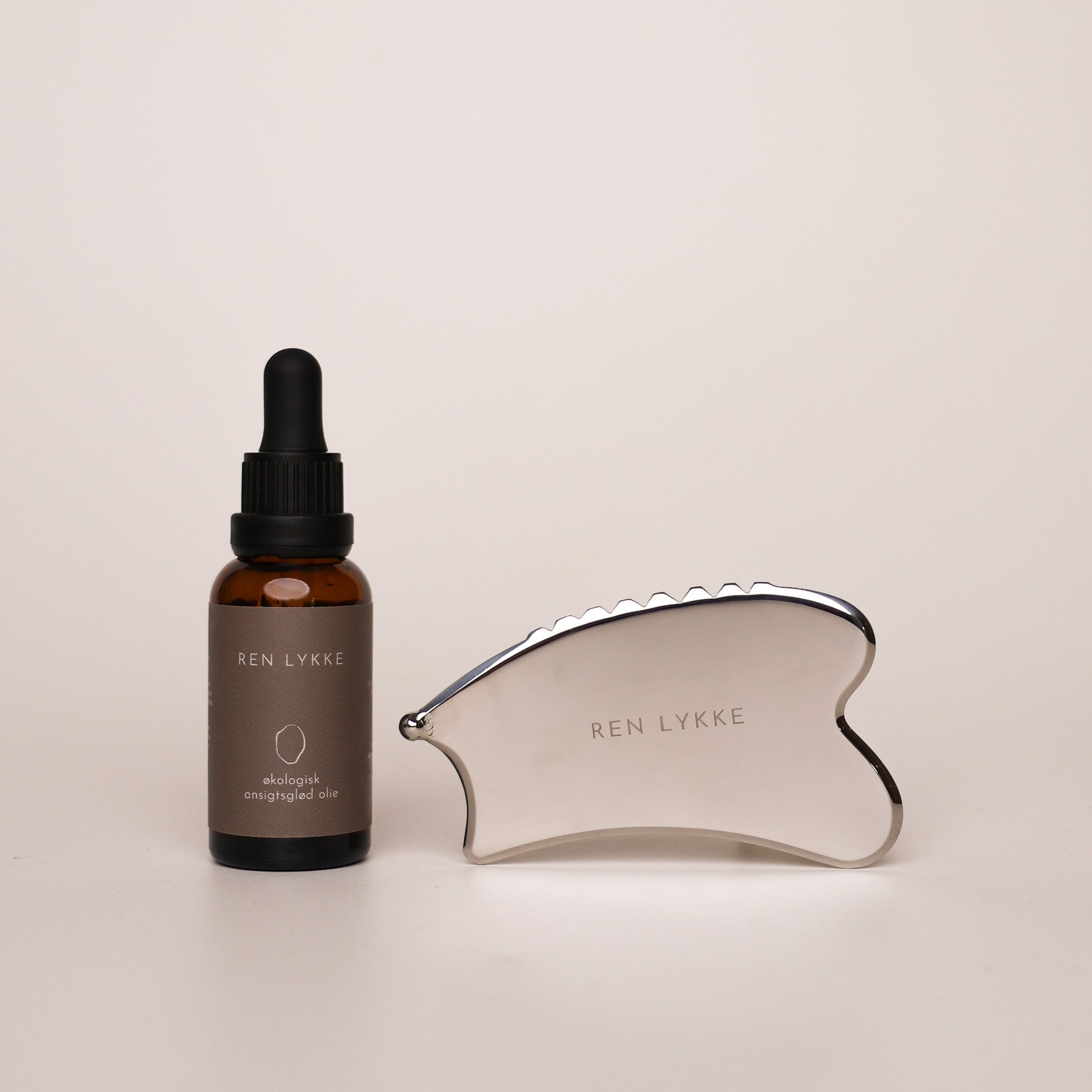 Pakke | Gua sha med ansigtsglød olie